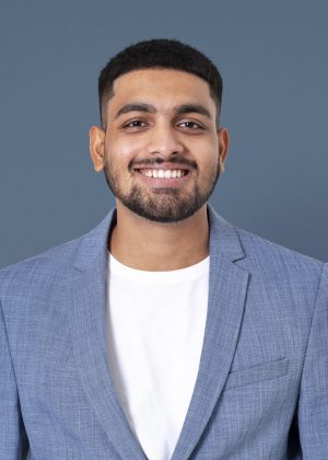 Cheerful Indian businessman smiling closeup portrait for jobs an Cheerful Indian businessman smiling closeup portrait for jobs and career campaign